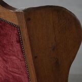 Antique English rocking chair in wood with red velvet upholstery, 19th century.