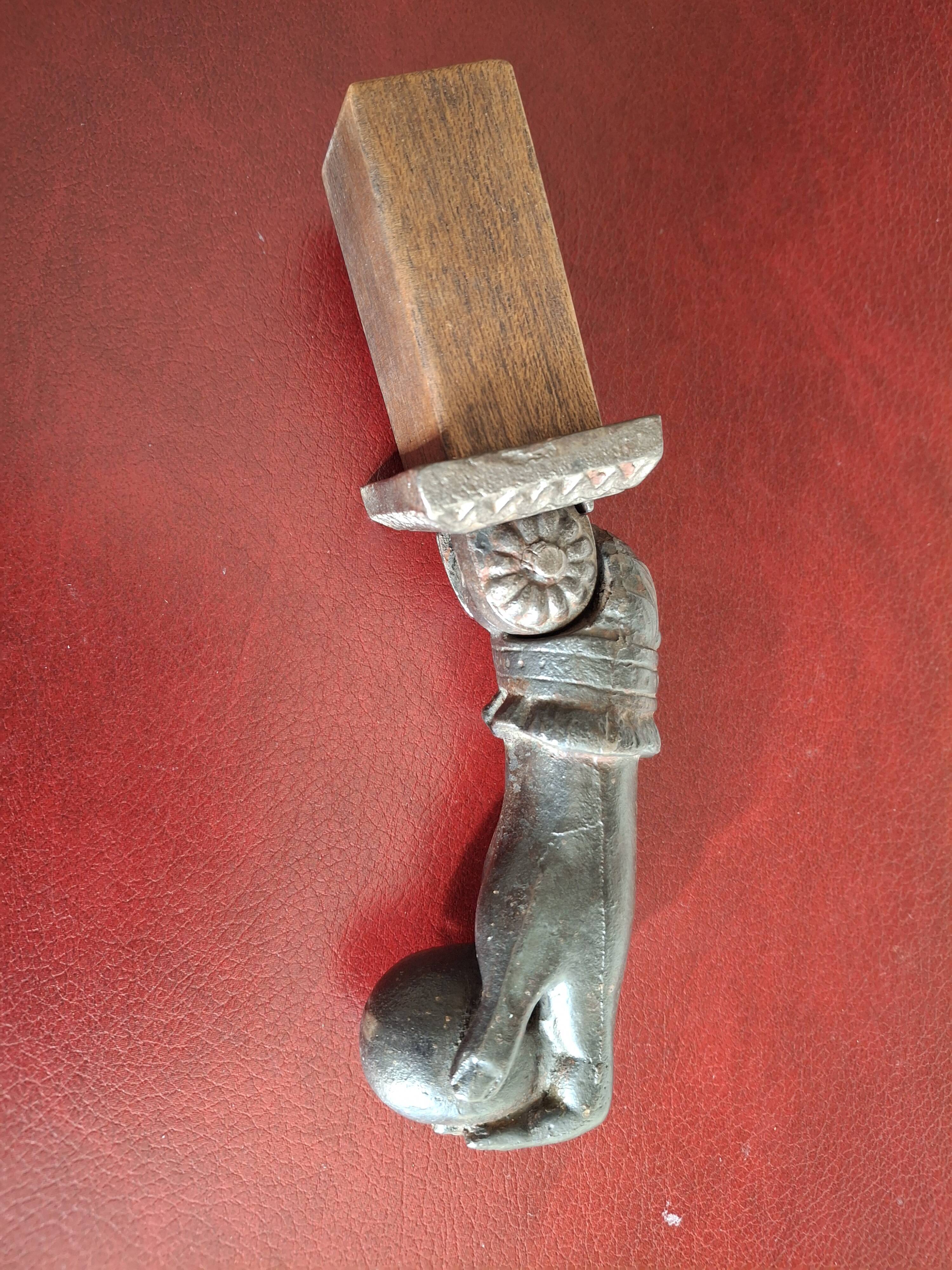 Cast iron door knocker from the 19th century or earlier.