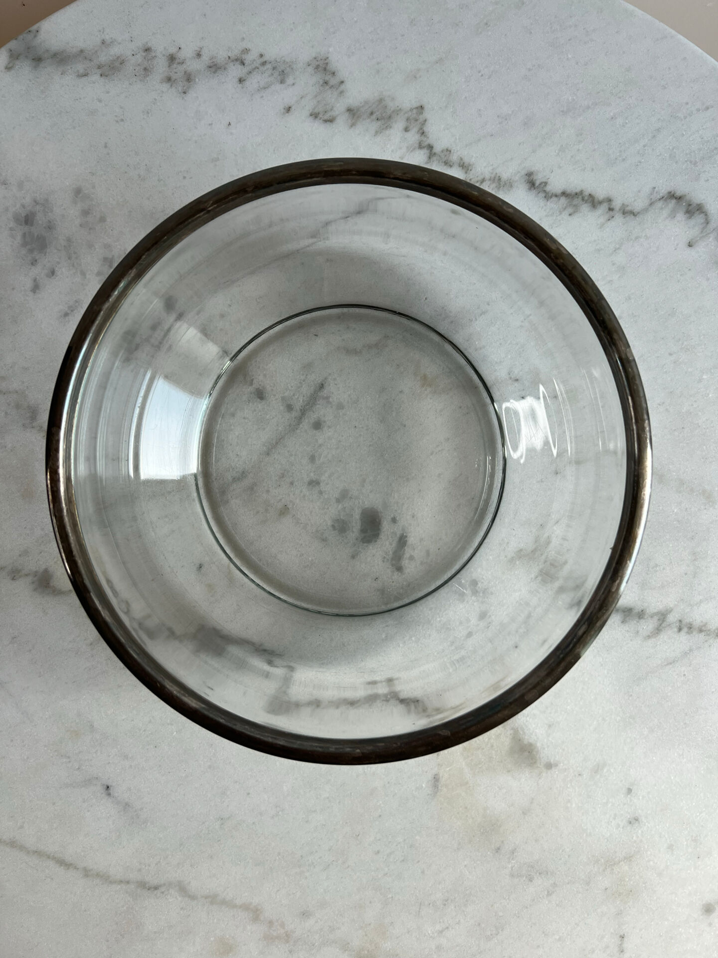 Glass and silver-plated metal salad bowl, silver rim.