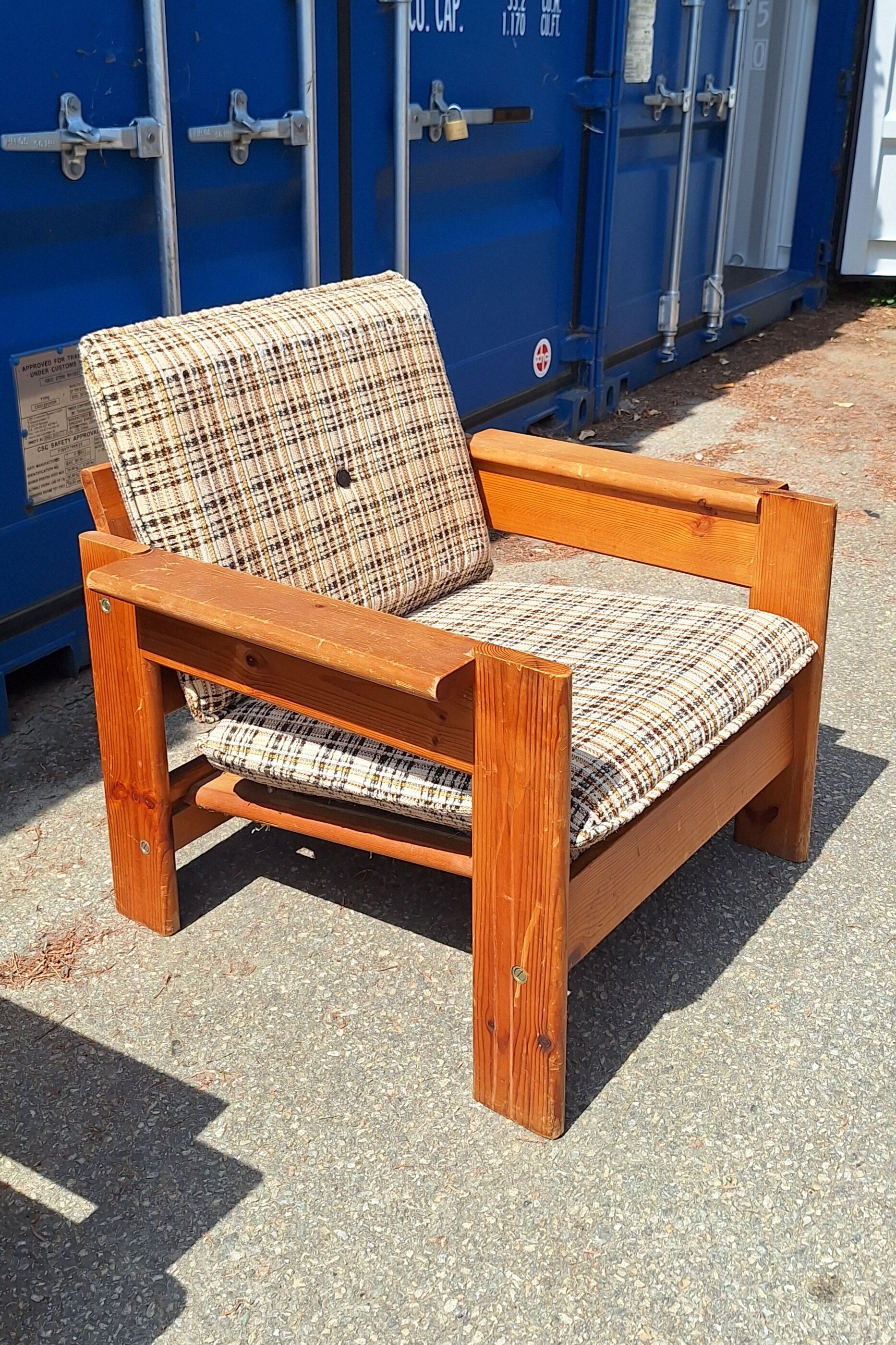 Brutalist-style bench and armchairs in 1970s pine.