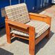 Brutalist-style bench and armchairs in 1970s pine.