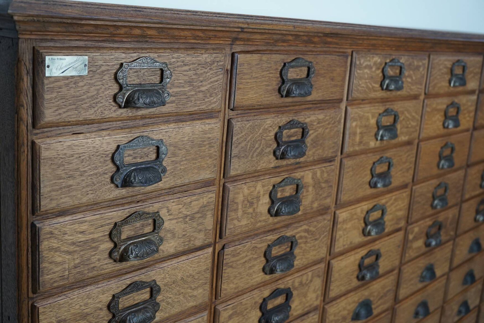 Antique French oak filing / apothecary cabinet by Chouanard, ca 1910