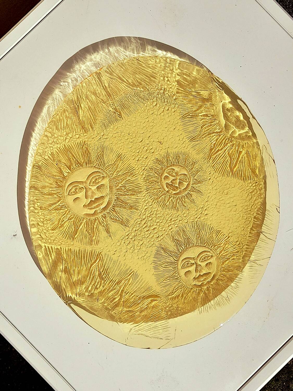 Glass plate decorated with suns, 1980.