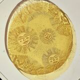Glass plate decorated with suns, 1980.