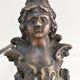 Pair of bronze andirons with black patina, 19th century, female caryatids