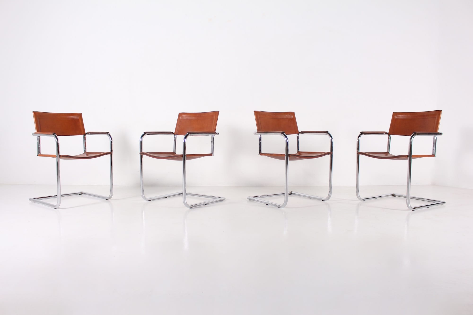 4 Matteo Grassi leather cogna cantilever armchairs