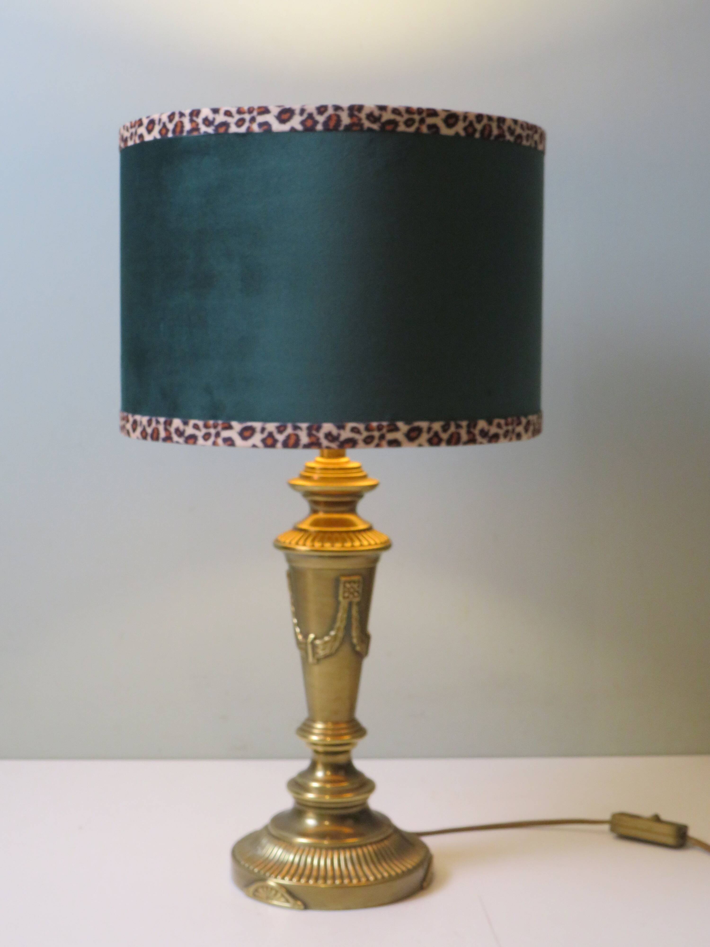 Vintage brass table lamp with green velvet shade.