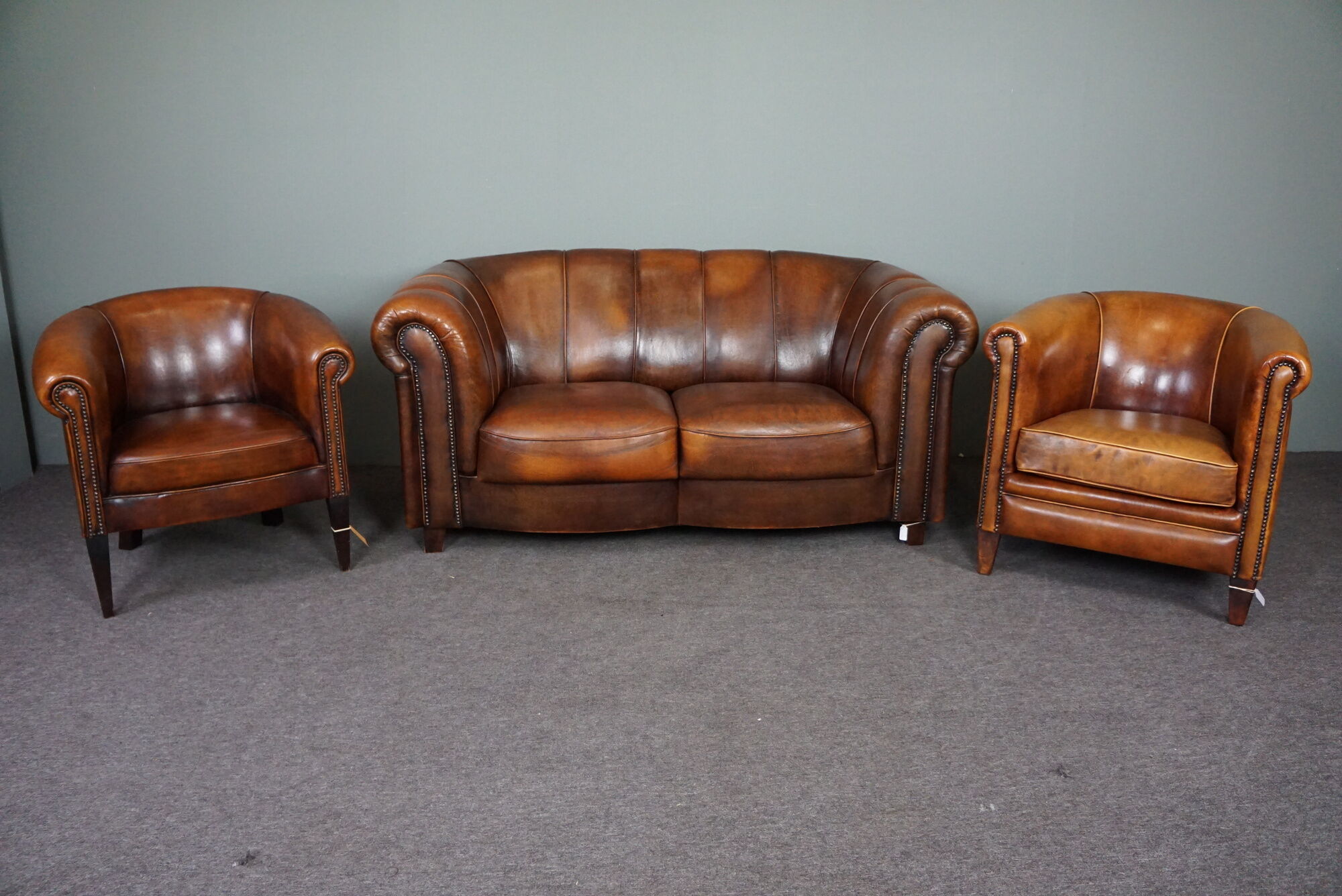 Beautiful sheep leather set of two club chairs and a 2 seater sofa