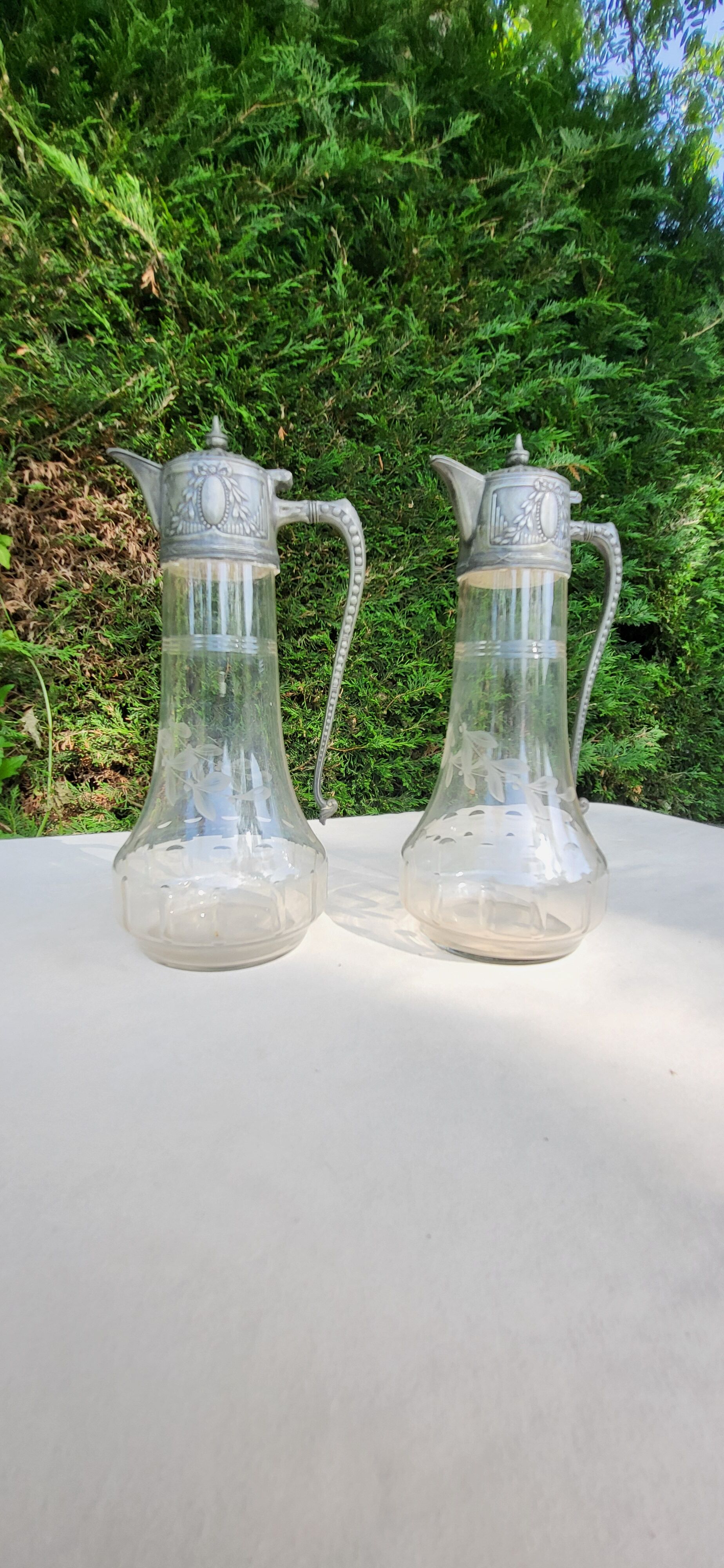 Pair of crystal and pewter jugs