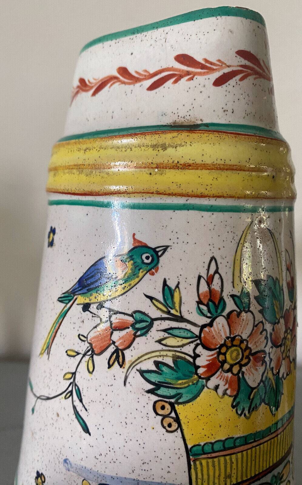 Old ceramic pitcher (18th century?) decorated with polychrome exotic birds