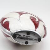 Red and white metal vase