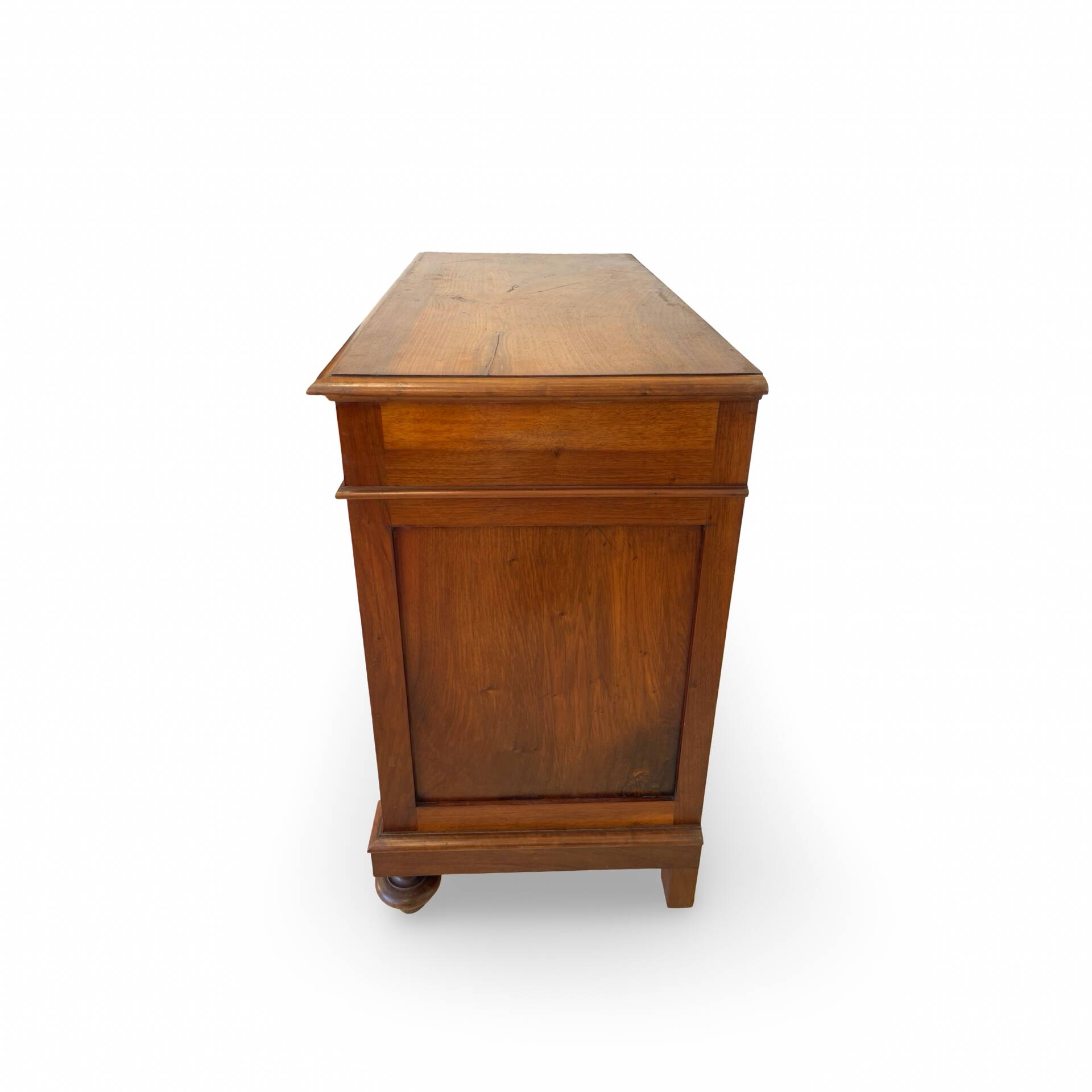 Antique walnut commode with bronze handles in the shape of a lion's mask,