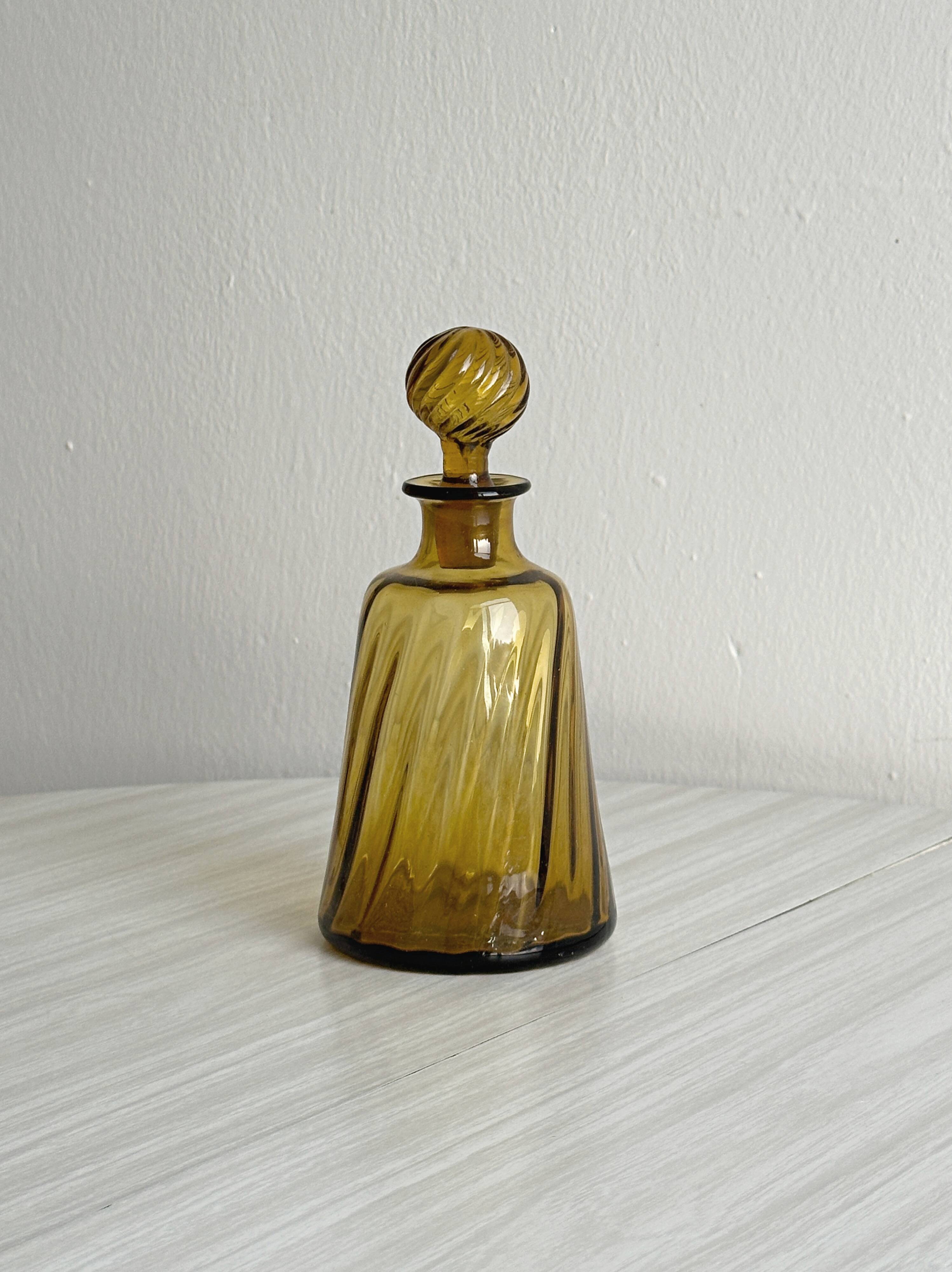 Twisted amber glass carafe