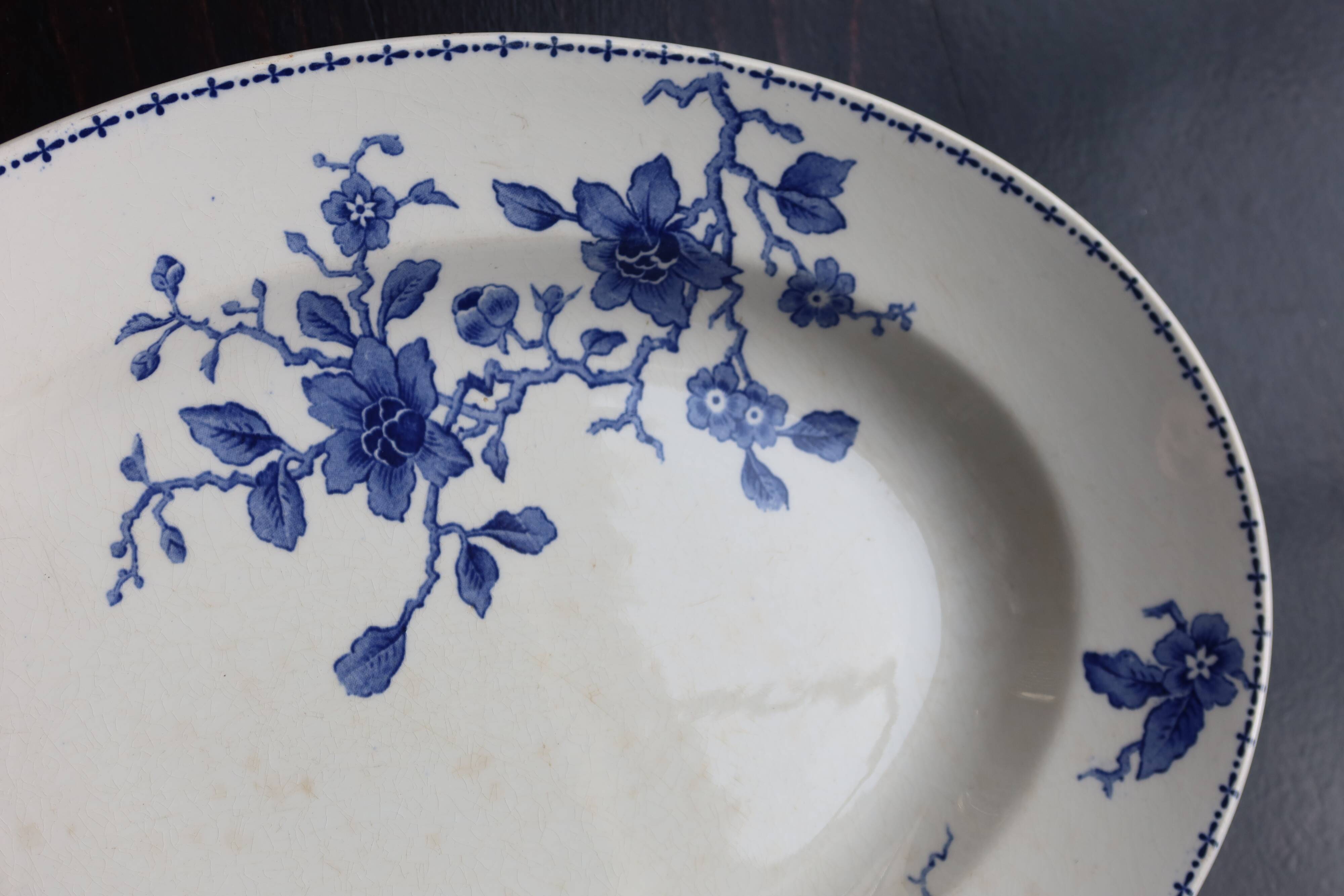 Antique serving dish in white and blue earthenware.