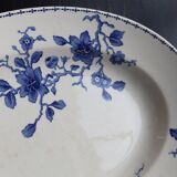 Antique serving dish in white and blue earthenware.