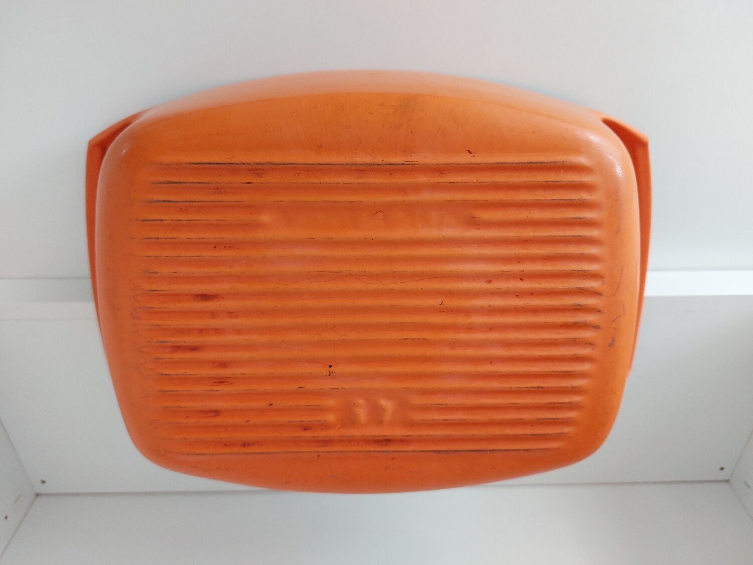 Double casserole in orange cast iron Le Creuset design Raymond Loewy