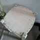 Vintage wooden stool with white peeling paint