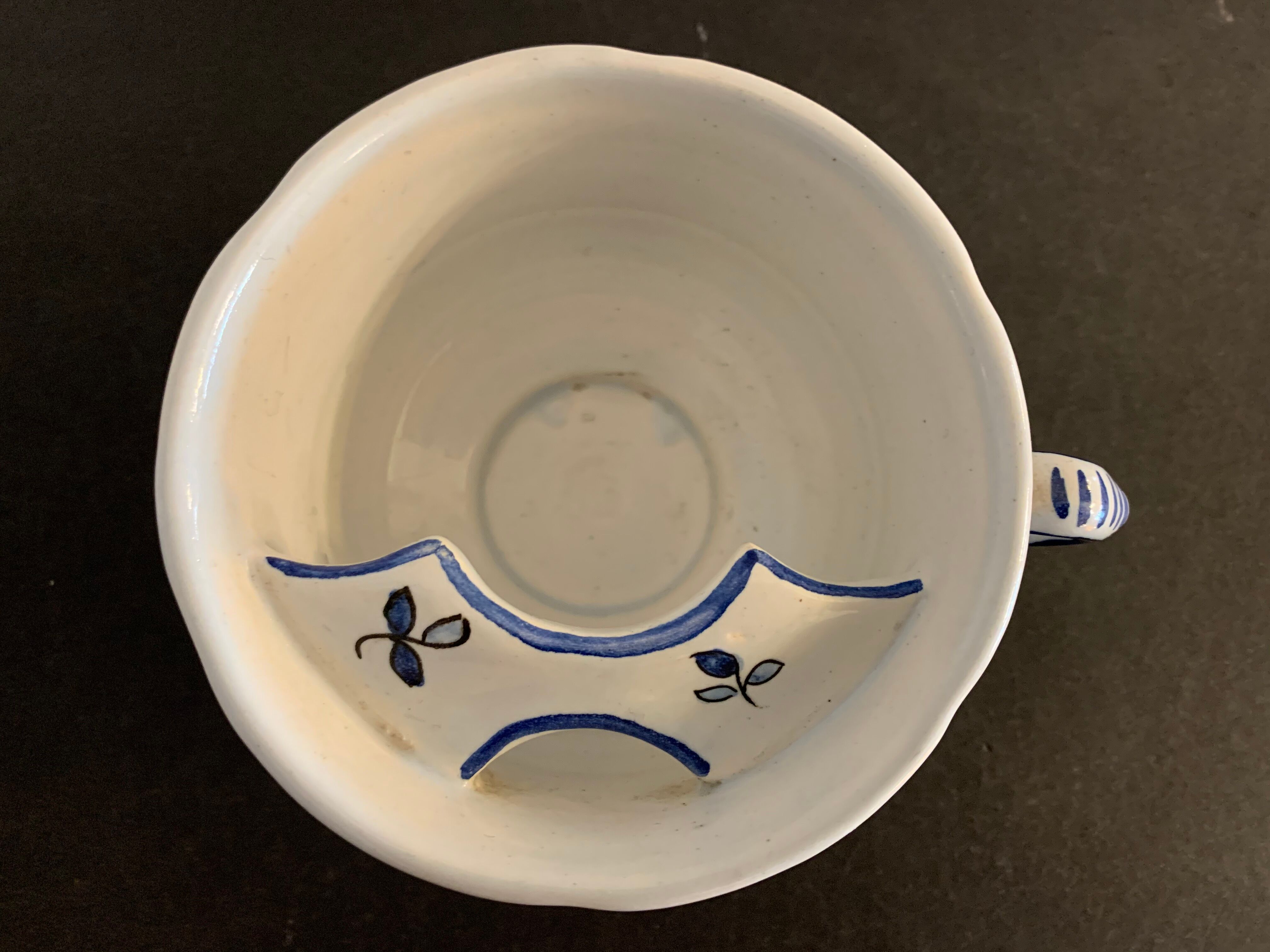 Old mustache cup and its under cup, Rouen earthenware