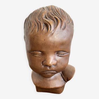 Brown child's bust by Paridon, signed 240 .V.V.