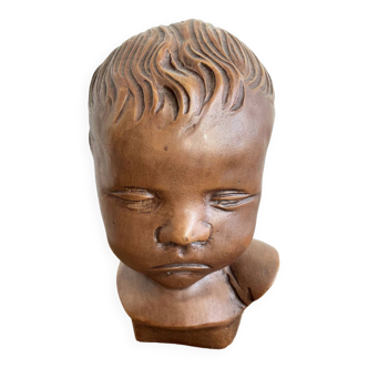 Brown child's bust by Paridon, signed 240 .V.V.