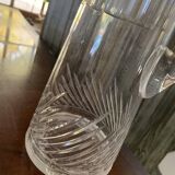 Transparent crystal pitcher, mid-century Hungarian, conical silhouette, sculptural handle and cut decoration.