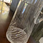 Transparent crystal pitcher, mid-century Hungarian, conical silhouette, sculptural handle and cut decoration.