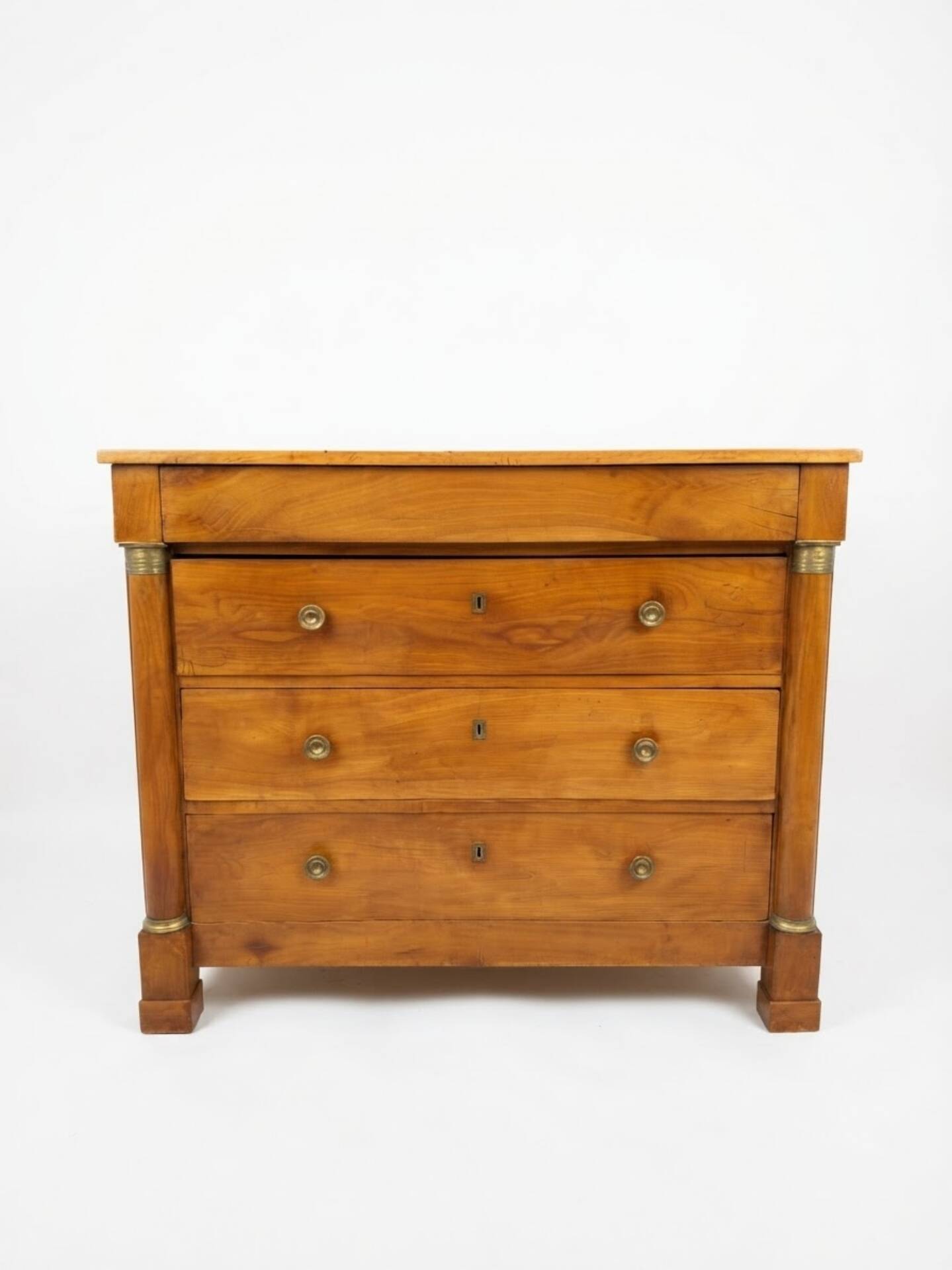 Empire style chest of drawers in cherry wood