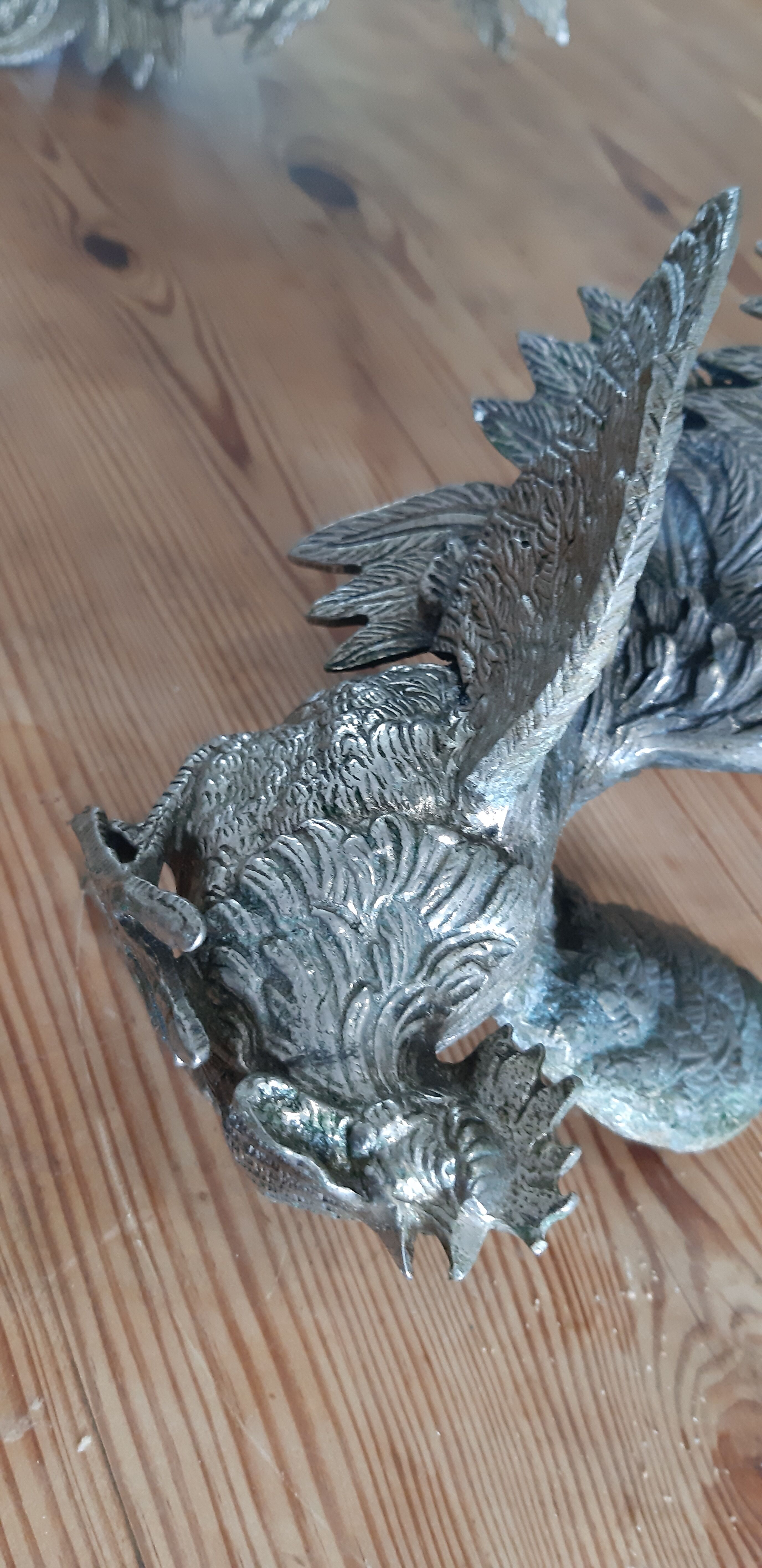 2 silver metal roosters