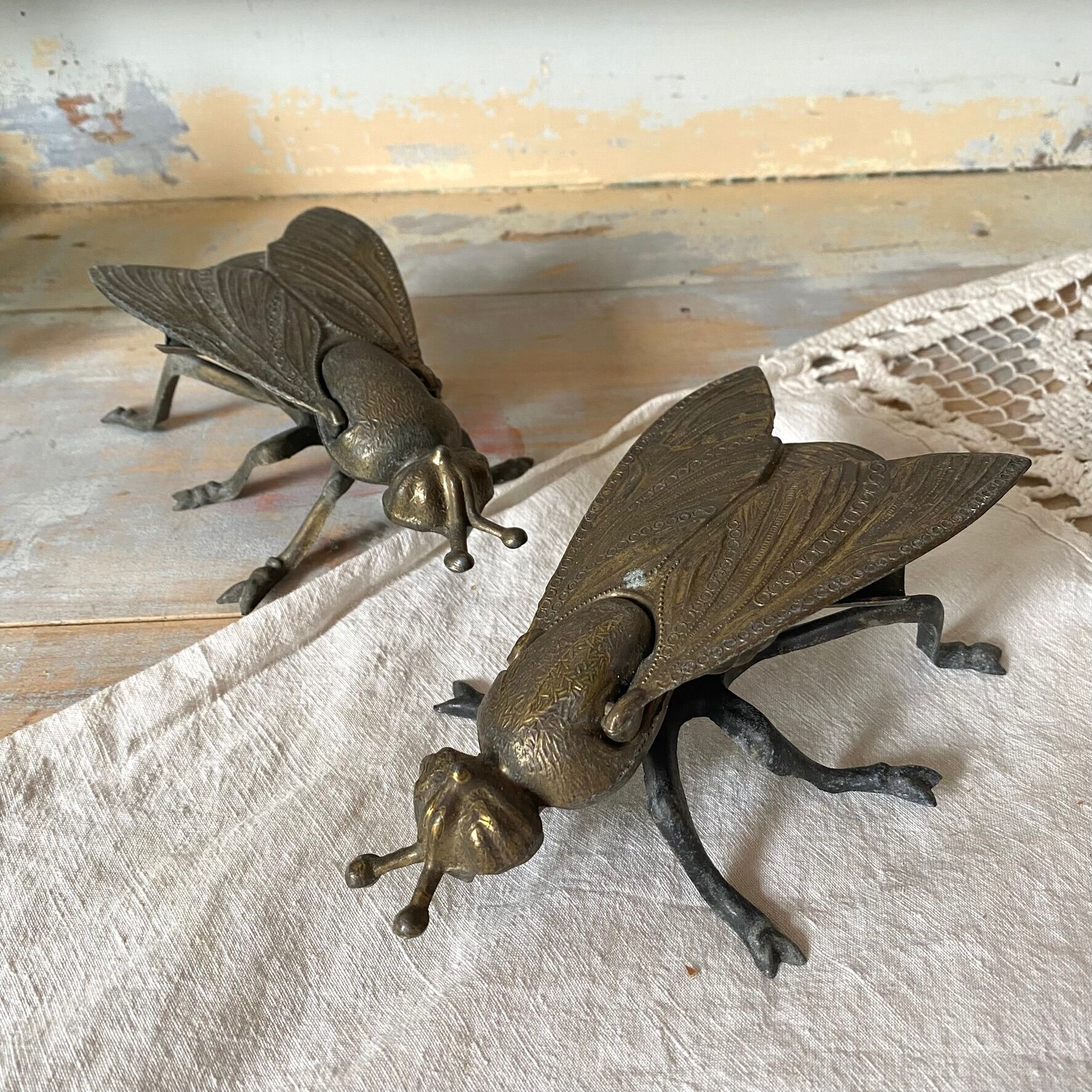 2 metal ashtrays with insect fly designs from the 1950s-60s.