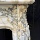 Louis XV style fireplace in purple breccia marble, circa 1880.