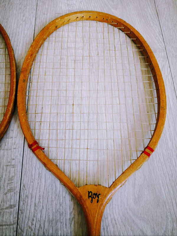Pair of old wooden badminton rackets