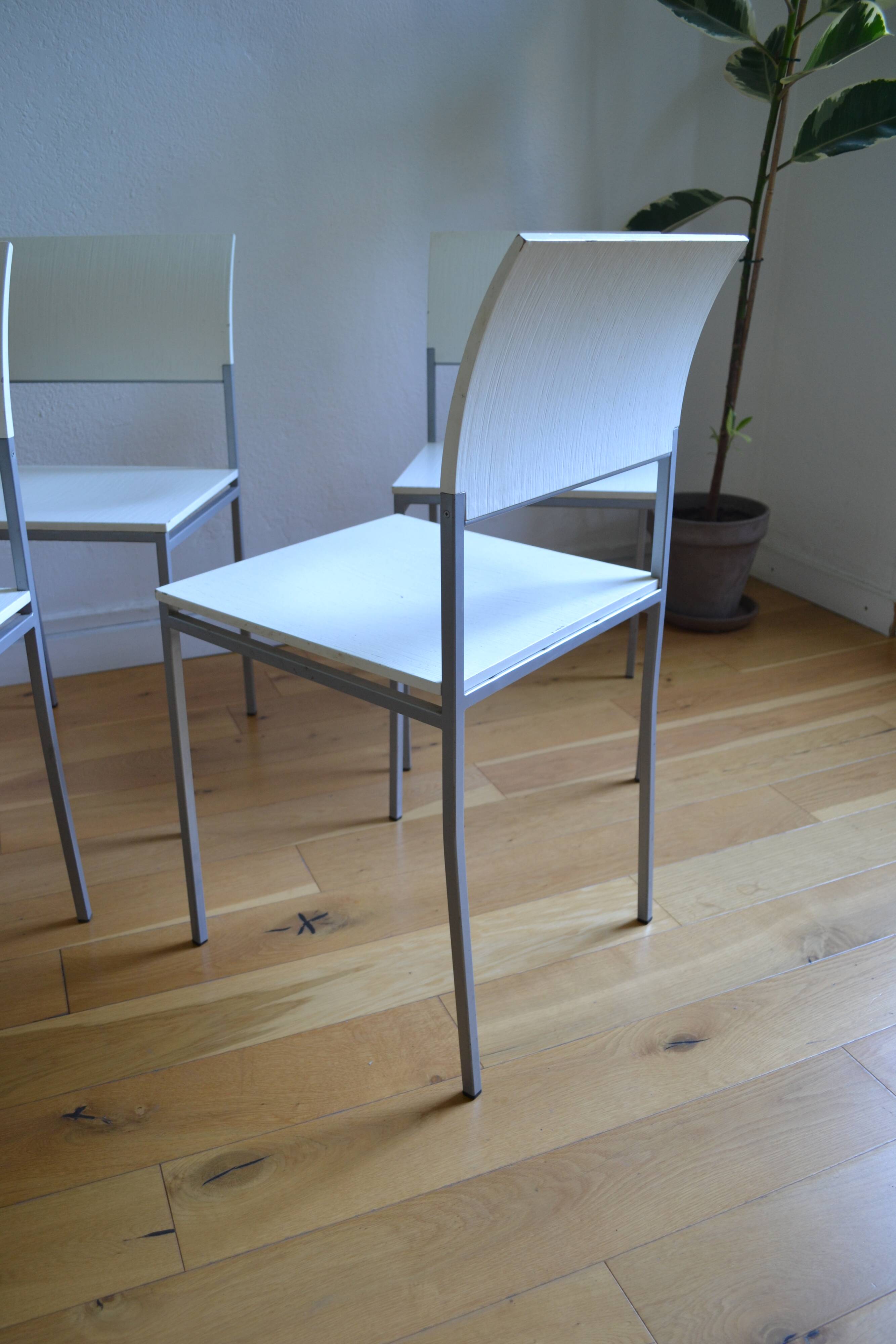 Set of 4 vintage metal and wood chairs from the 1990s.