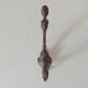 Antique wall coat hook from the 19th century in Victorian cast iron style.