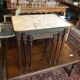 Pull-out tables in brass marble and wood