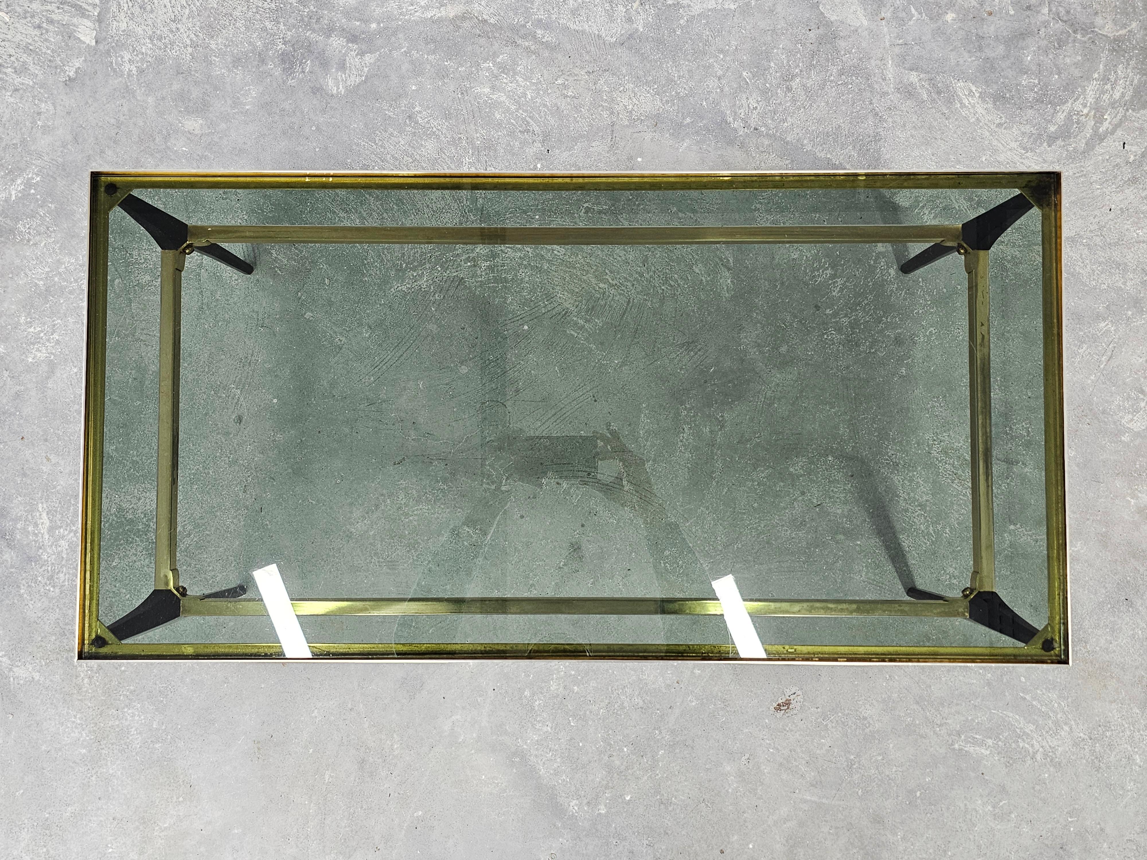 Mid Century Modern coffee table with gold-plated metal and smoked glass.