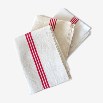old mixed-race cotton tea towels with red bedding