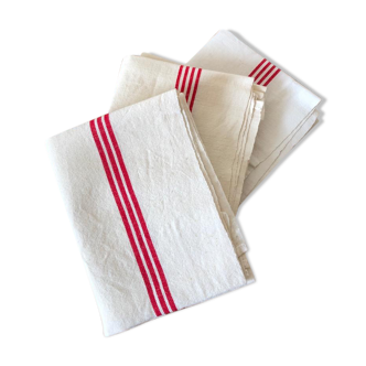 old mixed-race cotton tea towels with red bedding