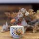 Upcycled cup candle