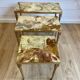 Set of 3 vintage nesting tables in onyx and gold metal from the 1970s.