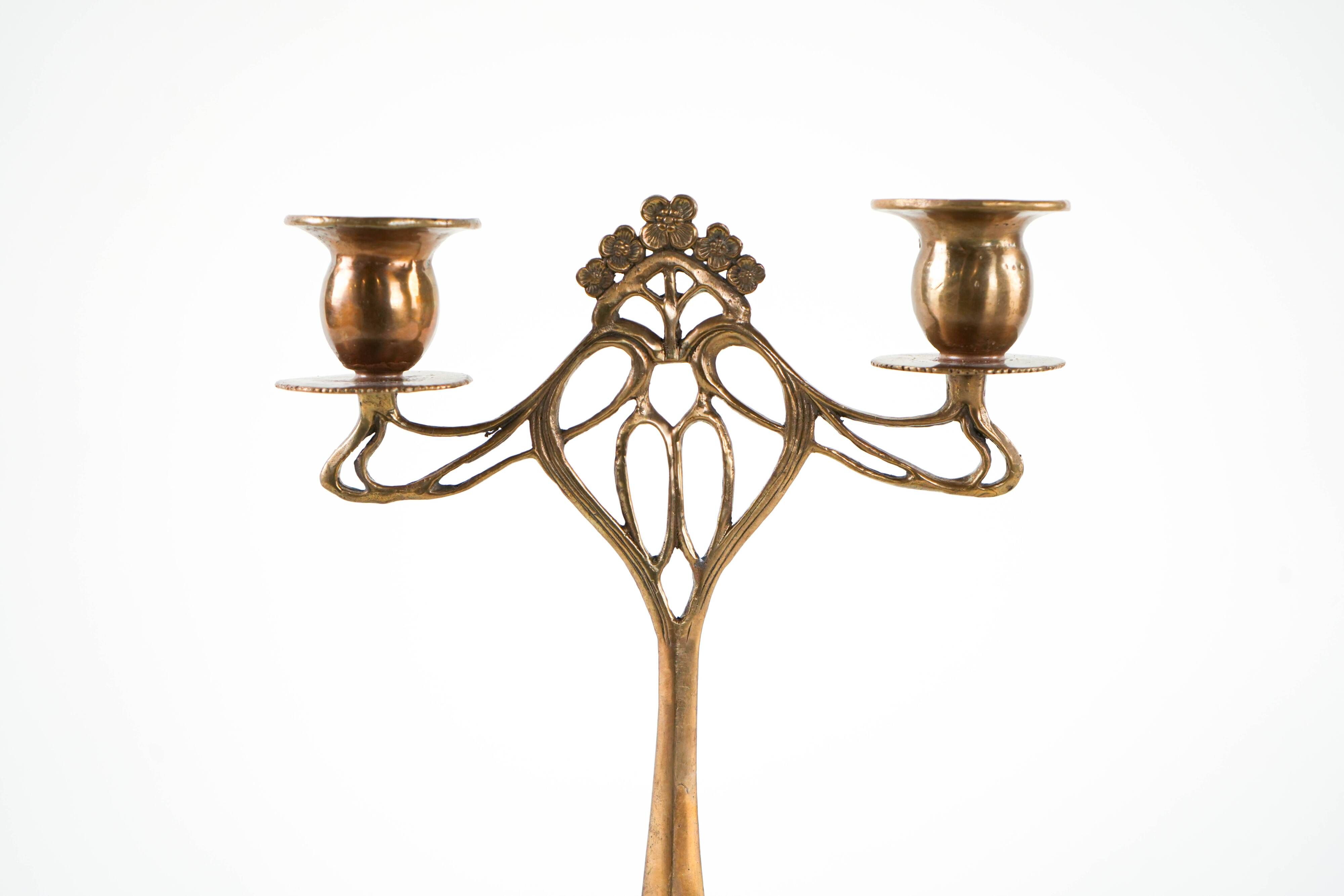 Art Nouveau brass candlestick with floral ornamentation, two arms, European