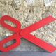 Wooden sign in the shape of scissors