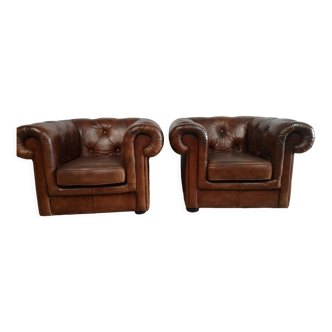 Brown leather chesterfield armchairs