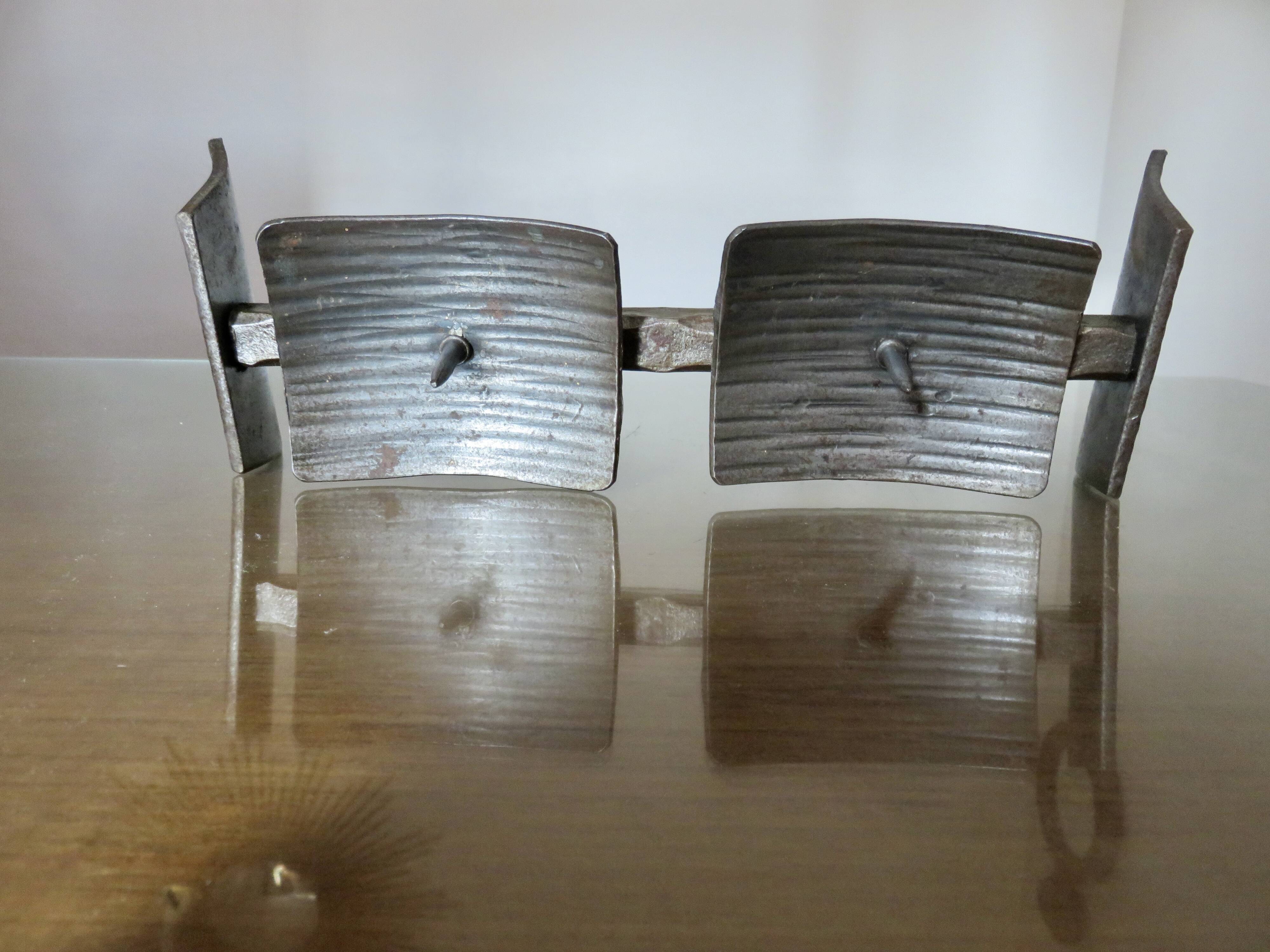 Large brutalist candlestick in the style of the Marolles workshops, raw steel.