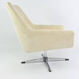 Cream corduroy swivel shell armchairs