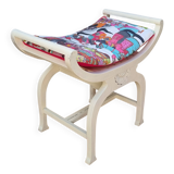 Curule stool in patinated carved wood, Manuel Canovas seat, 60 cm