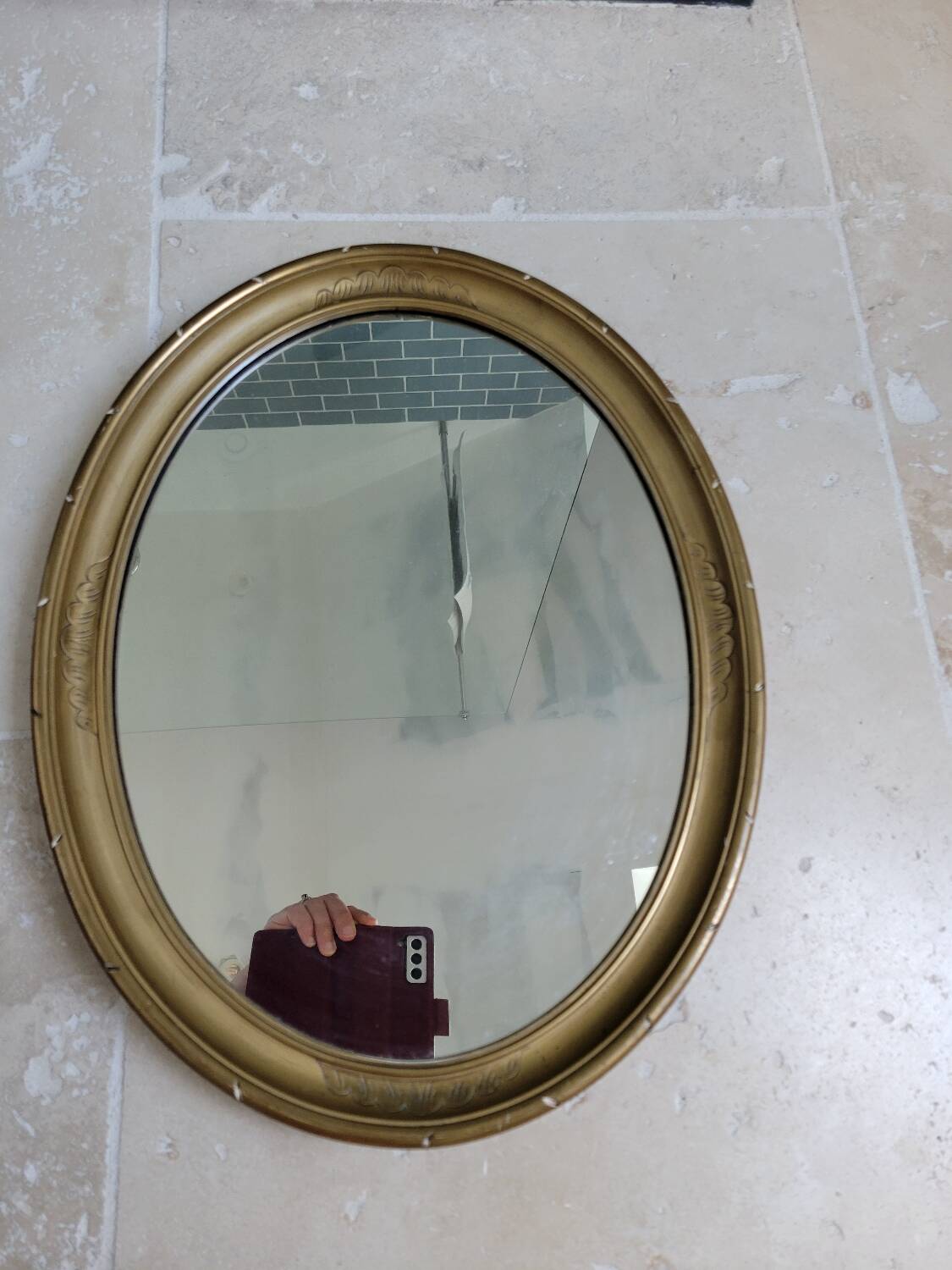 Oval mirror in gilded stucco 45 cm