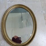 Oval mirror in gilded stucco 45 cm