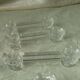 Set of 7 glass knife rests featuring a small duck.