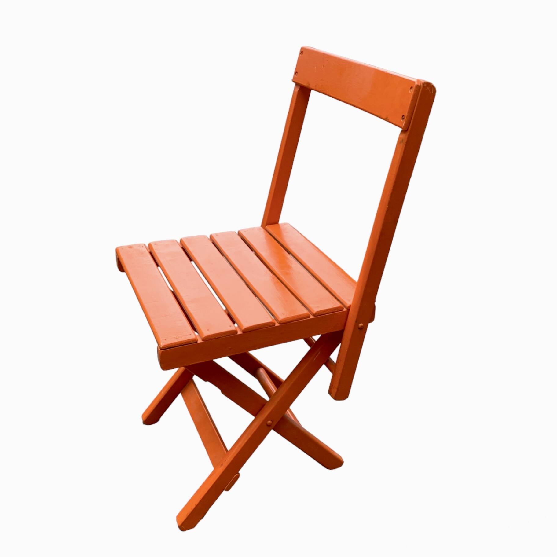 Vintage folding chair in orange painted wood