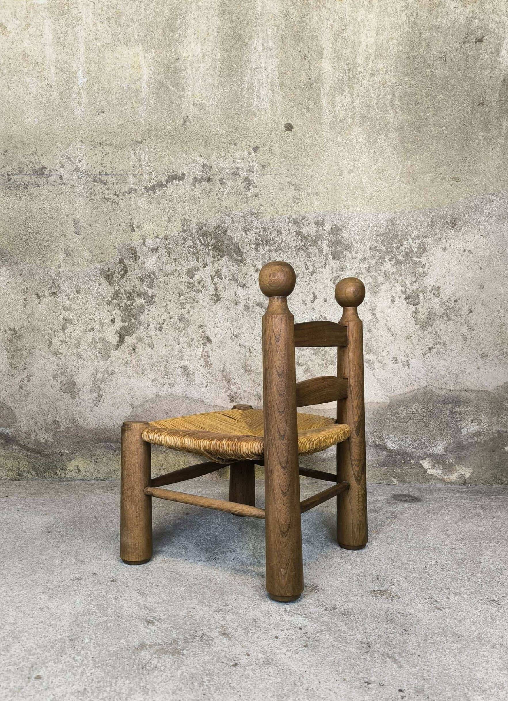 Vintage low chair in wood and straw